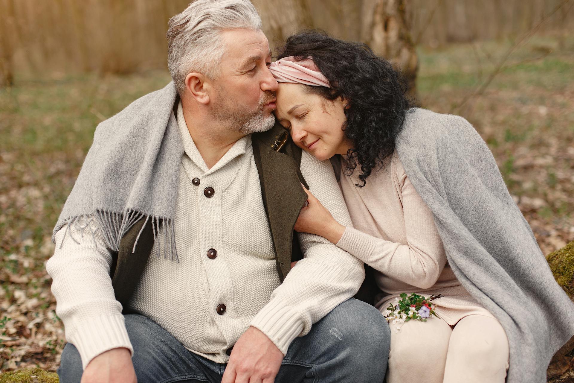 Old man giving kisss to his partner on the head